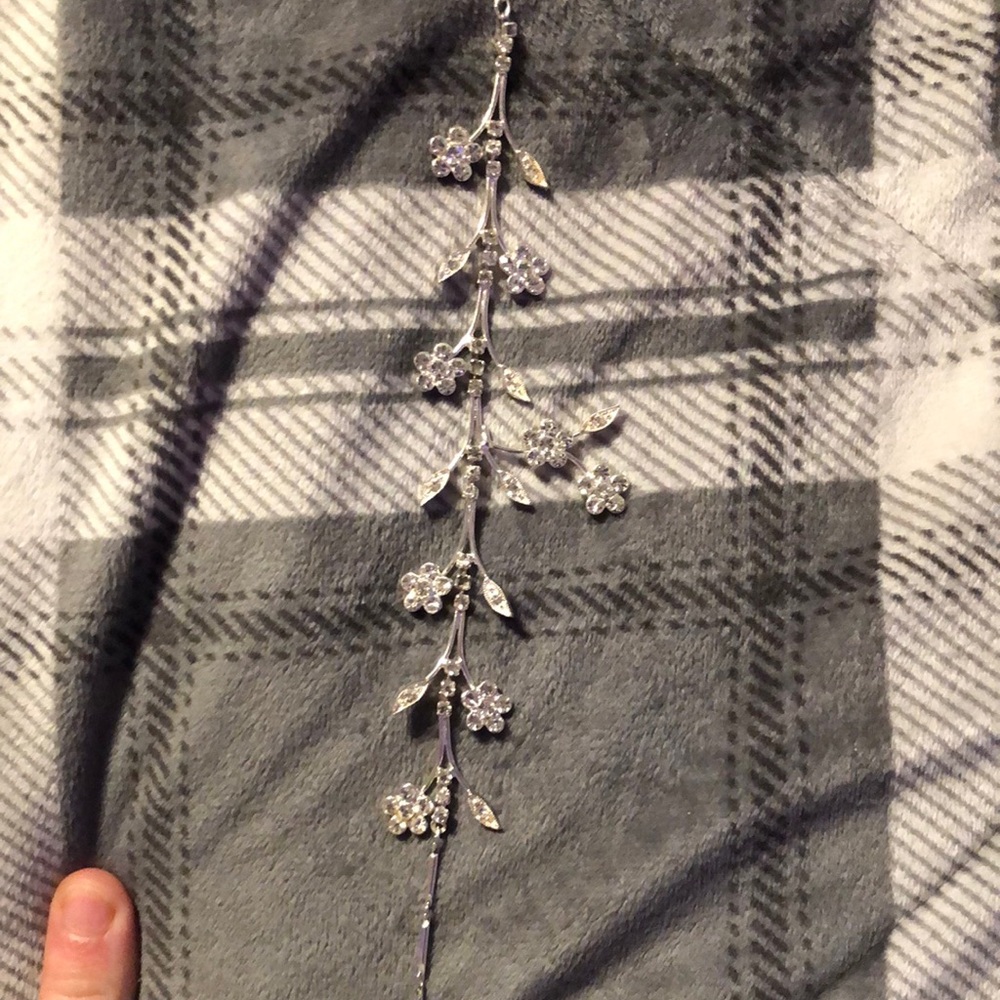 Short to medium length. Silver with diamond flowers